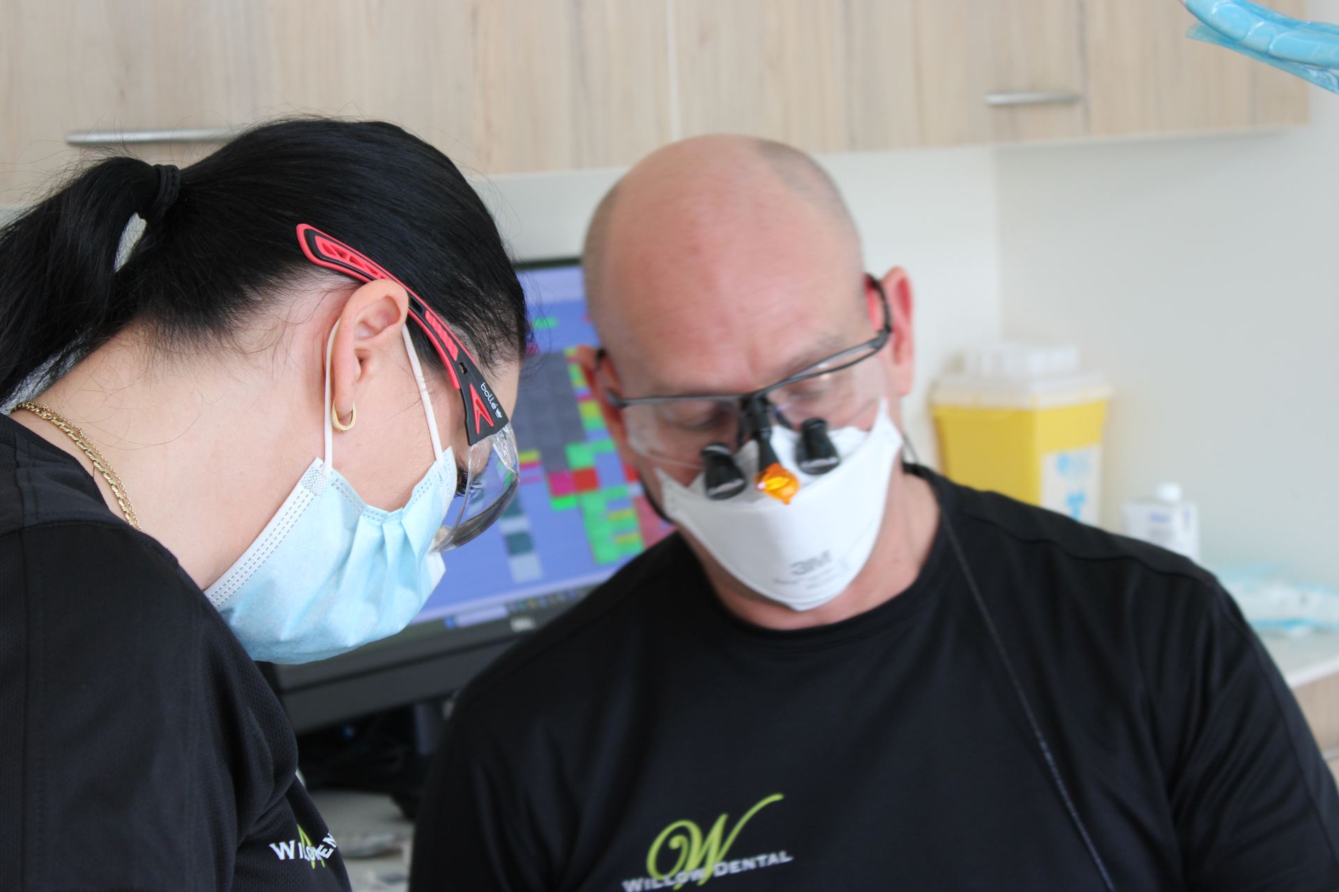 Clinician fitting a sleep apnea appliance at Willow Dental