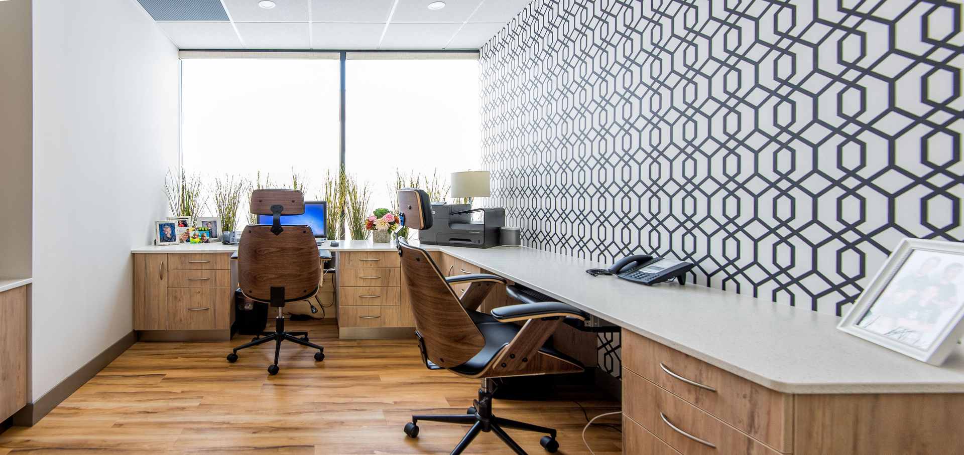 Willow Dental Associates admin office with long desk, windows and patterned wall in Mississauga, ON